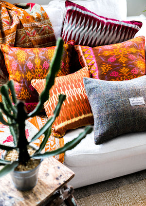 Colourful Ikat Cushions and Grey Harris Tweed Cushion in a White Sofa with Cactus Plant